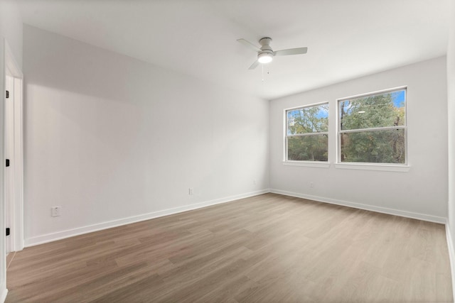 spare room featuring ceiling fan and light hardwood / wood-style flooring