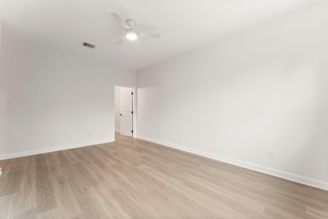 spare room with ceiling fan and light hardwood / wood-style floors