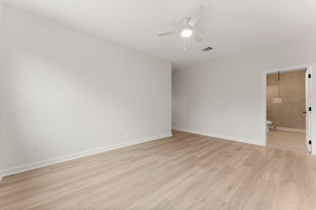 unfurnished room featuring ceiling fan and light hardwood / wood-style flooring