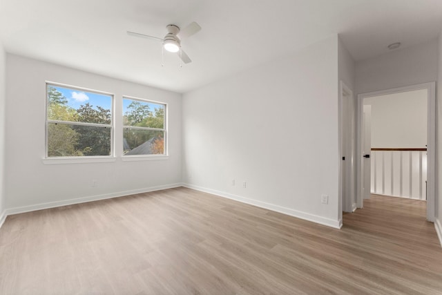 unfurnished room featuring light hardwood / wood-style floors and ceiling fan