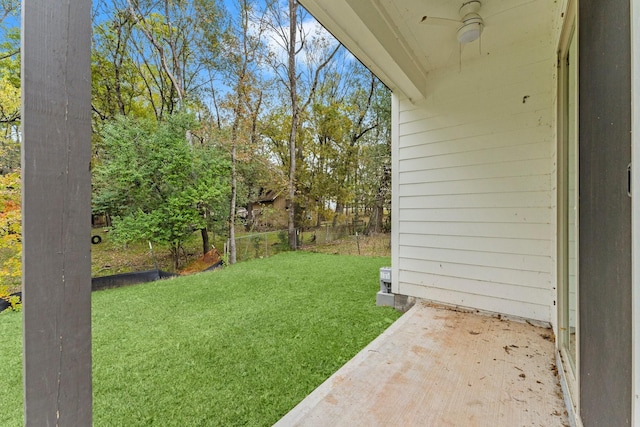 view of yard featuring ceiling fan