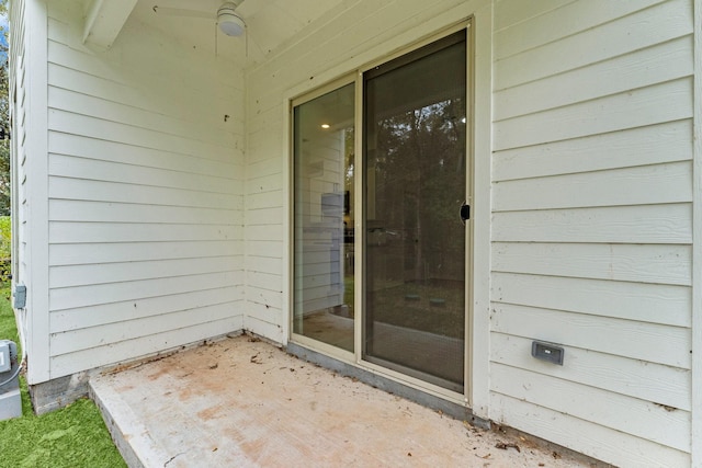 entrance to property with a patio