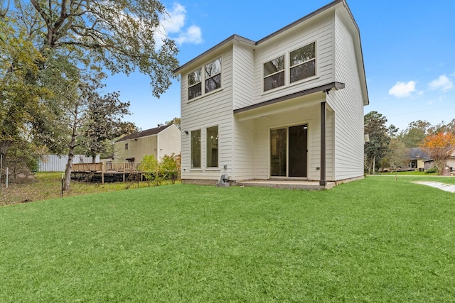 back of house with a yard