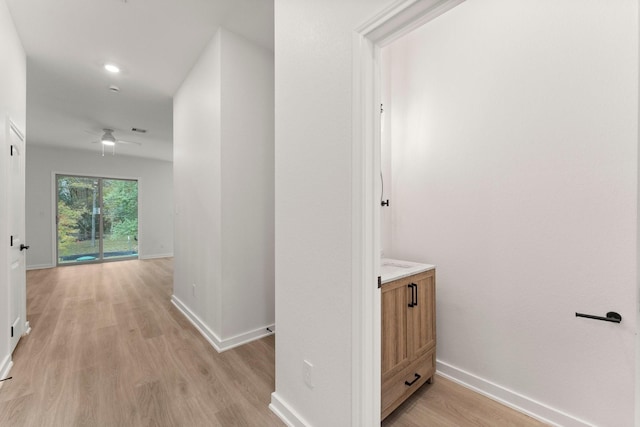 hallway with light wood-type flooring