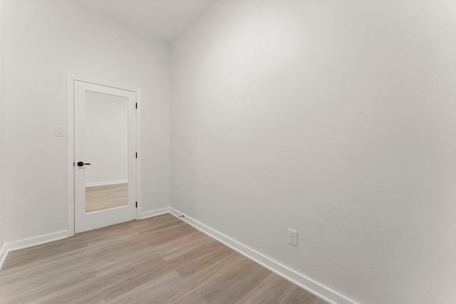 unfurnished room with light hardwood / wood-style floors