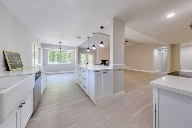 kitchen with pendant lighting, white cabinets, dishwasher, lofted ceiling, and french doors