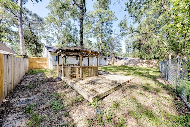 view of yard featuring a gazebo and a deck