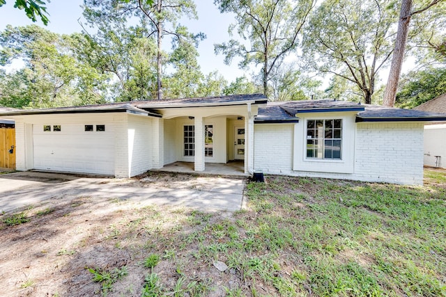 view of front of property with a garage