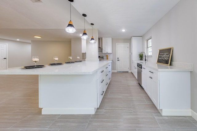 kitchen with white cabinetry, backsplash, hanging light fixtures, stainless steel dishwasher, and sink