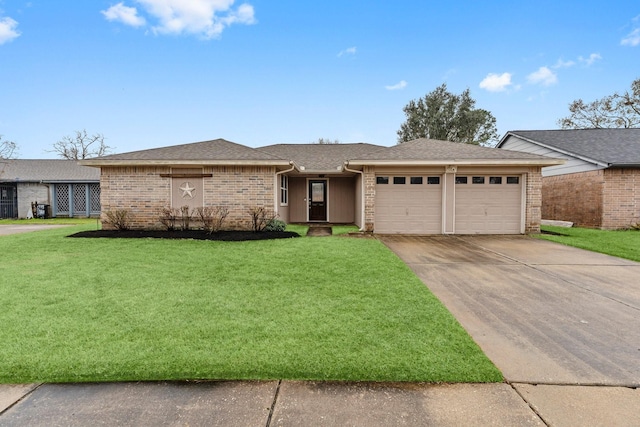 ranch-style home with a garage and a front lawn