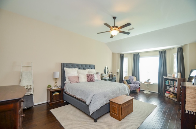 bedroom featuring ceiling fan, dark hardwood / wood-style floors, and lofted ceiling