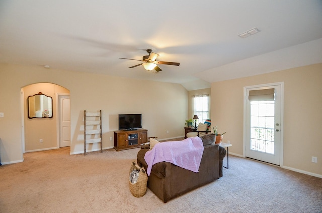 living room featuring vaulted ceiling, ceiling fan, and light carpet