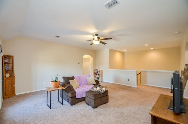 carpeted living room with lofted ceiling and ceiling fan