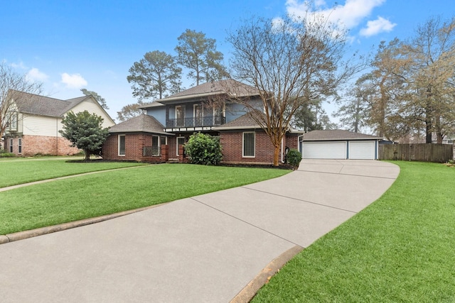 view of front facade featuring a balcony, a garage, an outdoor structure, and a front yard