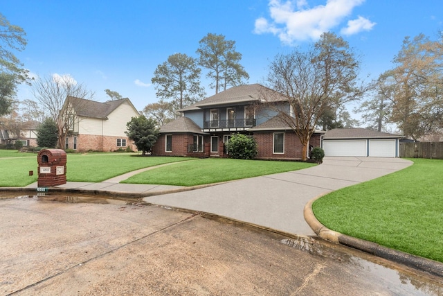 view of front of house featuring an outbuilding, a garage, and a front lawn