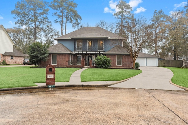 front facade with a balcony, a garage, and a front lawn