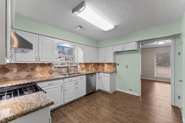 kitchen with sink, white cabinets, stainless steel dishwasher, light stone counters, and dark wood-type flooring