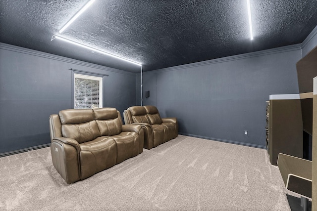 carpeted cinema room with ornamental molding and a textured ceiling