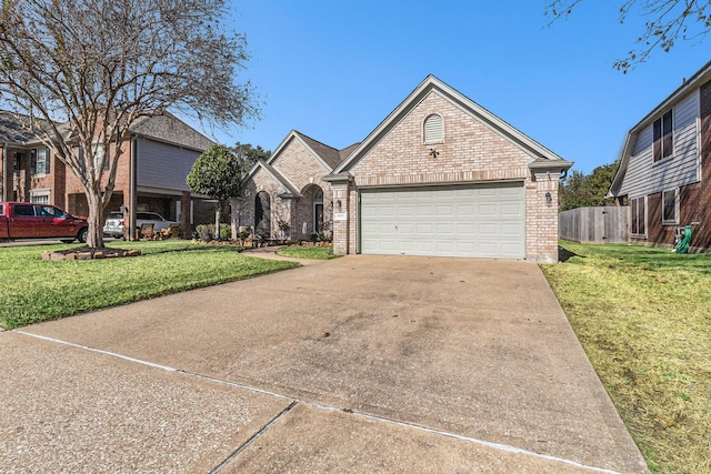 view of front facade featuring a front yard and a garage