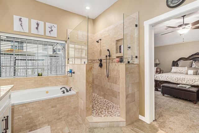 bathroom featuring vanity, ceiling fan, and independent shower and bath