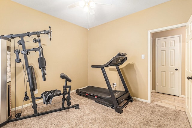 exercise room with ceiling fan and light carpet