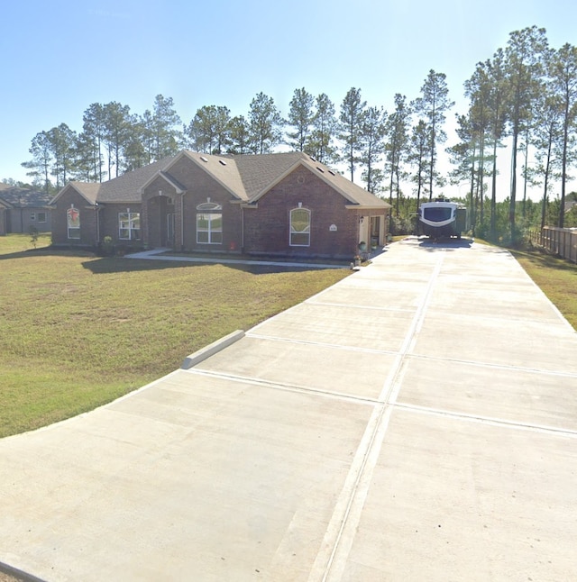 ranch-style house with a front yard