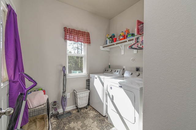 laundry area with light tile patterned flooring and washing machine and dryer