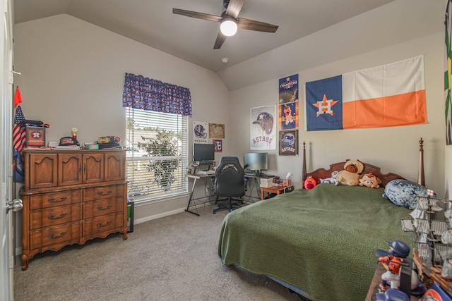 bedroom with ceiling fan, vaulted ceiling, and light carpet