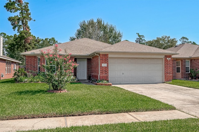 ranch-style home featuring a garage and a front lawn