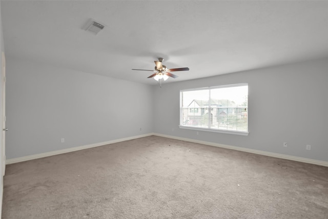 unfurnished room featuring carpet and ceiling fan