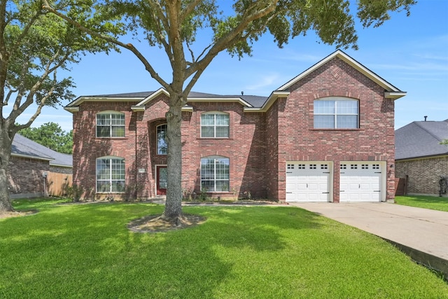 view of front of property featuring a garage and a front lawn