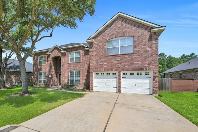 front of property featuring a front yard and a garage