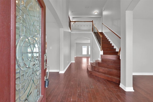 foyer entrance featuring dark wood-type flooring