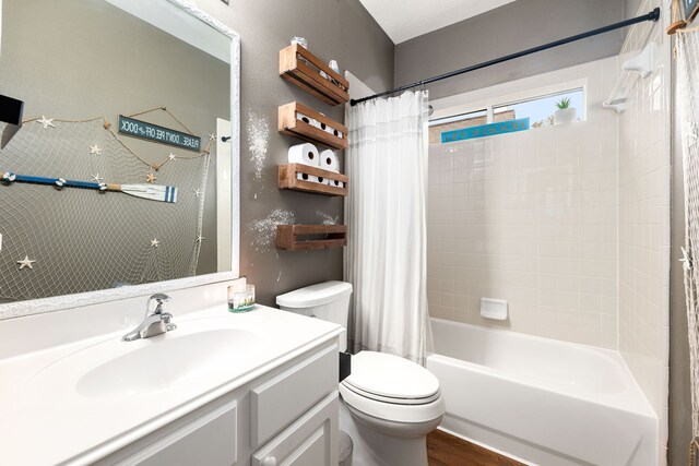 full bathroom featuring vanity, toilet, shower / bathtub combination with curtain, and hardwood / wood-style flooring