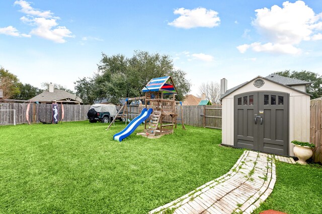 view of yard with a playground and a shed