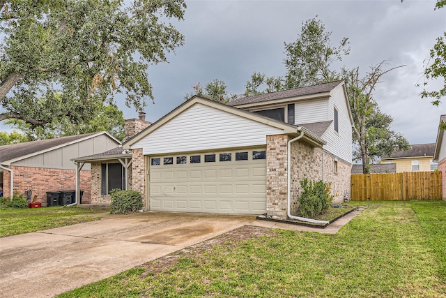 view of front of house with a front lawn and a garage