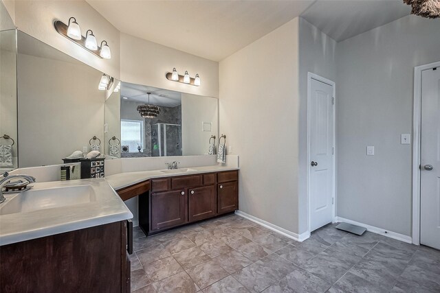 bathroom with vanity and a shower with shower door