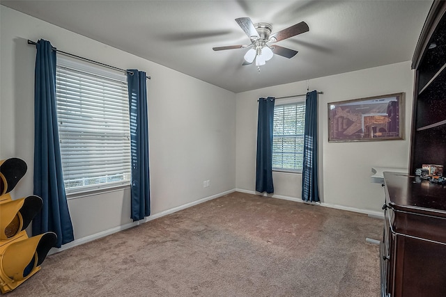 interior space with ceiling fan