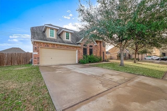 view of front of property with a garage and a front lawn