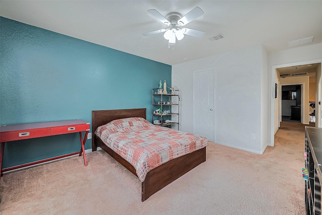 carpeted bedroom with ceiling fan