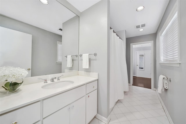 bathroom with tile patterned flooring and vanity