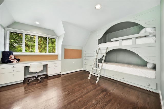 bedroom featuring vaulted ceiling and dark hardwood / wood-style floors