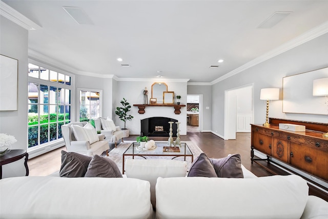 living room featuring ornamental molding and hardwood / wood-style floors