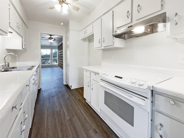 kitchen featuring white cabinets, dark wood-type flooring, white range with electric cooktop, sink, and ceiling fan