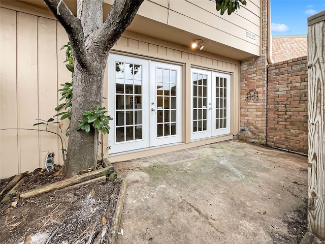 doorway to property with a patio area and french doors