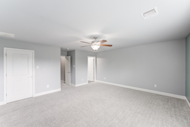 unfurnished room featuring ceiling fan and light colored carpet