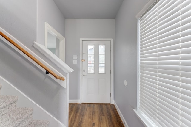 entrance foyer with dark hardwood / wood-style flooring