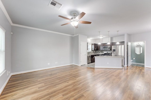 unfurnished living room with light wood-type flooring, ceiling fan, crown molding, and plenty of natural light