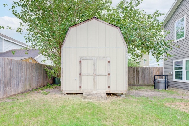 view of outbuilding featuring a lawn