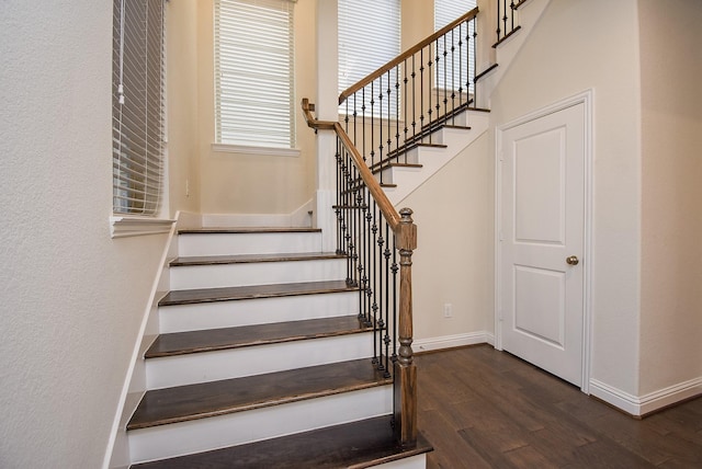 stairs featuring hardwood / wood-style flooring